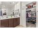 The primary bath features a dual sink vanity and a view of the closet at 607 W Tenia Trl, San Tan Valley, AZ 85140