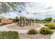 Community playground offers modern play equipment, seating, and a safe, landscaped area for outdoor fun at 607 W Tenia Trl, San Tan Valley, AZ 85140
