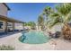 Backyard features pool, covered patio, lounge chairs and mature landscaping in a private setting at 656 W Devon Ct, Gilbert, AZ 85233