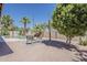 A private backyard featuring a sparkling pool surrounded by desert landscaping and a patio seating area at 656 W Devon Ct, Gilbert, AZ 85233