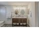 Charming bathroom features a dual sink vanity, gray plank flooring, tiled backsplash, and bathtub at 656 W Devon Ct, Gilbert, AZ 85233