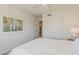 This light and airy bedroom features a ceiling fan, neutral paint, and plush carpeting at 656 W Devon Ct, Gilbert, AZ 85233