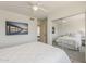 Relaxing bedroom features a ceiling fan, neutral paint, and a mirrored closet to amplify the natural light at 656 W Devon Ct, Gilbert, AZ 85233