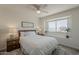 Inviting bedroom features soft, neutral colors and ample natural light from a large window at 656 W Devon Ct, Gilbert, AZ 85233