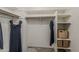Spacious walk-in closet with built-in shelving and hanging rods for optimal organization at 656 W Devon Ct, Gilbert, AZ 85233