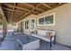 Stylish covered patio with outdoor seating, perfect for relaxing or entertaining by the pool at 656 W Devon Ct, Gilbert, AZ 85233