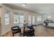 Bright dining area features wood floors, multiple windows, and a backyard view at 656 W Devon Ct, Gilbert, AZ 85233