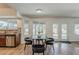 Dining area with modern table, chairs, and an abundance of natural light and backyard views at 656 W Devon Ct, Gilbert, AZ 85233