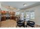 Well-lit dining area features stylish chairs, backyard views, and open access to the kitchen at 656 W Devon Ct, Gilbert, AZ 85233