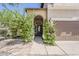 Inviting front entrance with blooming bushes at 656 W Devon Ct, Gilbert, AZ 85233