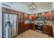 Spacious kitchen with modern stainless-steel appliances, stylish cabinetry, and modern light fixture at 656 W Devon Ct, Gilbert, AZ 85233