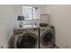 Laundry room featuring modern washer and dryer, plus decorative accents at 656 W Devon Ct, Gilbert, AZ 85233