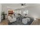 Open living area with wood floors, connecting the kitchen, dining, and living spaces at 656 W Devon Ct, Gilbert, AZ 85233