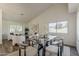 Bright living room featuring a modern dining set at 656 W Devon Ct, Gilbert, AZ 85233