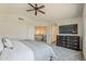 View of the main bedroom features a ceiling fan, dresser, and doorway leading to the hallway at 656 W Devon Ct, Gilbert, AZ 85233