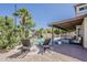 Beautiful backyard pool and covered patio area with lounge chairs for outdoor enjoyment at 656 W Devon Ct, Gilbert, AZ 85233