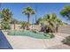 Inviting backyard pool with lush landscaping and waterfall feature at 656 W Devon Ct, Gilbert, AZ 85233