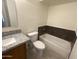 Full bathroom with shower-tub combo and granite vanity at 6605 N 46Th Ln, Glendale, AZ 85301
