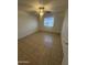 Comfortable bedroom with tile flooring, window and ceiling fan at 6605 N 46Th Ln, Glendale, AZ 85301
