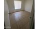 Cozy bedroom with tile floors, window and closet at 6605 N 46Th Ln, Glendale, AZ 85301
