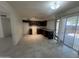 Kitchen featuring tile flooring, dark cabinets, granite countertops and sliding glass door at 6605 N 46Th Ln, Glendale, AZ 85301