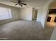 Bright living room with tile flooring, ceiling fan and window at 6605 N 46Th Ln, Glendale, AZ 85301