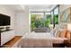 Bright bedroom with large windows, providing ample natural light and a peaceful garden view at 7117 E Rancho Vista Dr # 1012, Scottsdale, AZ 85251
