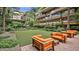 Lush courtyard with seating, a putting green, and views of the surrounding building at 7117 E Rancho Vista Dr # 1012, Scottsdale, AZ 85251