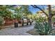 Outdoor grill area with two stainless steel grills, surrounded by greenery and a paved patio at 7117 E Rancho Vista Dr # 1012, Scottsdale, AZ 85251