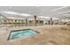 Large, well-lit indoor pool area with a hot tub, seating, and exercise equipment at 7117 E Rancho Vista Dr # 1012, Scottsdale, AZ 85251