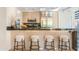 Breakfast bar in a modern kitchen with stainless steel appliances and counter seating at 7117 E Rancho Vista Dr # 1012, Scottsdale, AZ 85251