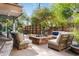 Inviting outdoor patio with a cozy fire pit, comfortable seating, and lush landscaping at 7117 E Rancho Vista Dr # 1012, Scottsdale, AZ 85251