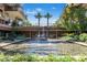 Community water feature with elevated waterfall and pond among lush landscaping at 7117 E Rancho Vista Dr # 1012, Scottsdale, AZ 85251