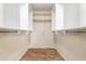 Spacious walk-in closet with custom shelving and hanging rods for optimal organization at 7117 E Rancho Vista Dr # 1012, Scottsdale, AZ 85251
