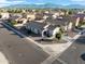 Aerial view of a well maintained neighborhood with mountain views in the distance at 7305 W Darrel Rd, Laveen, AZ 85339