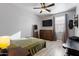 Bedroom featuring modern furnishings, hard surface floors, and ceiling fan at 7305 W Darrel Rd, Laveen, AZ 85339