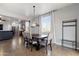 Elegant dining area with tile floors, modern furnishings, and natural light at 7305 W Darrel Rd, Laveen, AZ 85339
