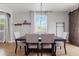 Stylish dining area with tile floors, comfortable seating, and ample natural light at 7305 W Darrel Rd, Laveen, AZ 85339