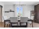 Bright dining room with a modern table set, perfect for Gathering meals at 7305 W Darrel Rd, Laveen, AZ 85339