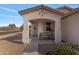 Charming covered porch with a cozy bench, perfect for enjoying the outdoors at 7305 W Darrel Rd, Laveen, AZ 85339