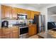 Functional kitchen with stainless steel appliances and granite countertops at 7305 W Darrel Rd, Laveen, AZ 85339