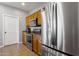 Kitchen featuring stainless steel refrigerator, microwave, range, and wooden cabinets at 7305 W Darrel Rd, Laveen, AZ 85339