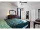 Bedroom featuring wood floors, a ceiling fan, and ample natural light at 7305 W Darrel Rd, Laveen, AZ 85339