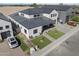 Expansive aerial shot reveals a modern home with lush landscaping and a brick driveway, showcasing luxury at 8503 S 9Th Dr # 17, Phoenix, AZ 85041