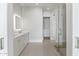 Bright bathroom featuring double vanity, backlit mirrors, and glass shower door to walk-in closet at 8503 S 9Th Dr # 17, Phoenix, AZ 85041