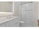 Elegant bathroom featuring subway tile, glass shower doors, and a quartz countertop at 8503 S 9Th Dr # 17, Phoenix, AZ 85041