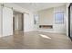 Bright bedroom with modern fireplace, high ceilings, recessed lights, and sliding glass door to ensuite bathroom at 8503 S 9Th Dr # 17, Phoenix, AZ 85041