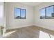 Bright bedroom with wood floors, large windows, and ample natural light at 8503 S 9Th Dr # 17, Phoenix, AZ 85041