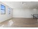 Bright bedroom featuring hardwood floors, recessed lighting, and two large windows at 8503 S 9Th Dr # 17, Phoenix, AZ 85041
