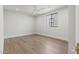 Bright bedroom with hardwood floors, recessed lighting, and a modern window at 8503 S 9Th Dr # 17, Phoenix, AZ 85041